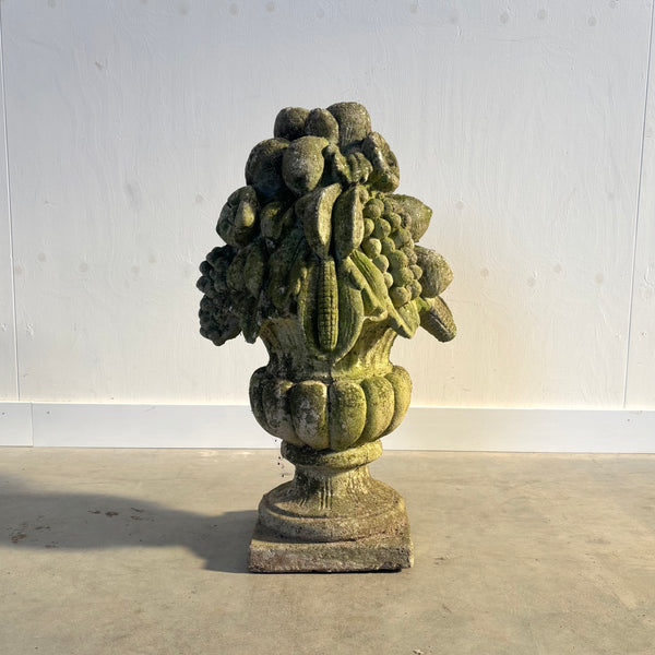 Ancient concrete potpourri of flowers and fruit