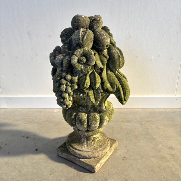 Ancient concrete potpourri of flowers and fruit
