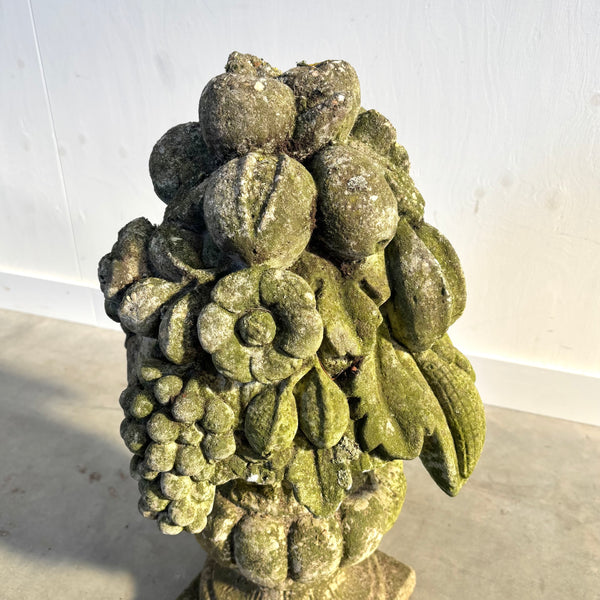 Ancient concrete potpourri of flowers and fruit