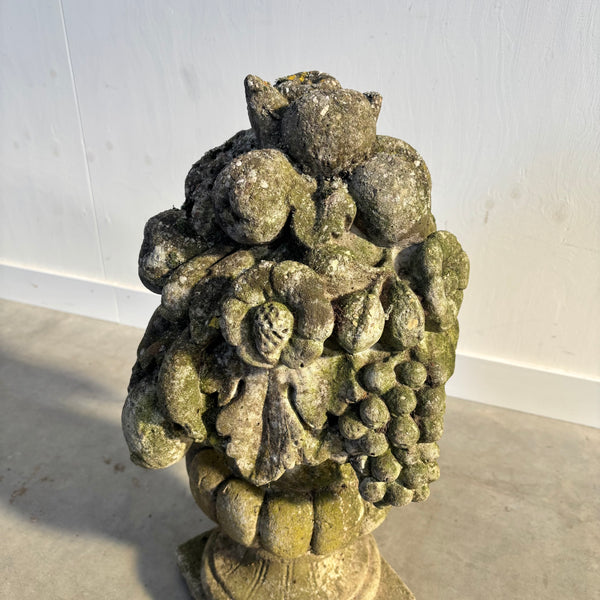 Ancient concrete potpourri of flowers and fruit
