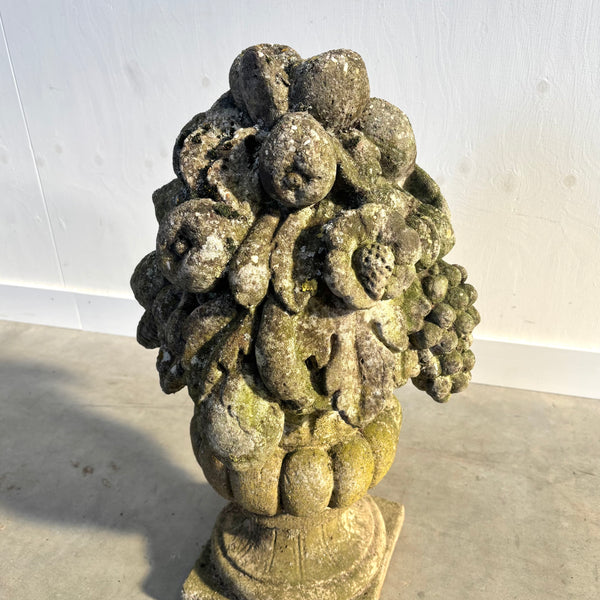 Ancient concrete potpourri of flowers and fruit