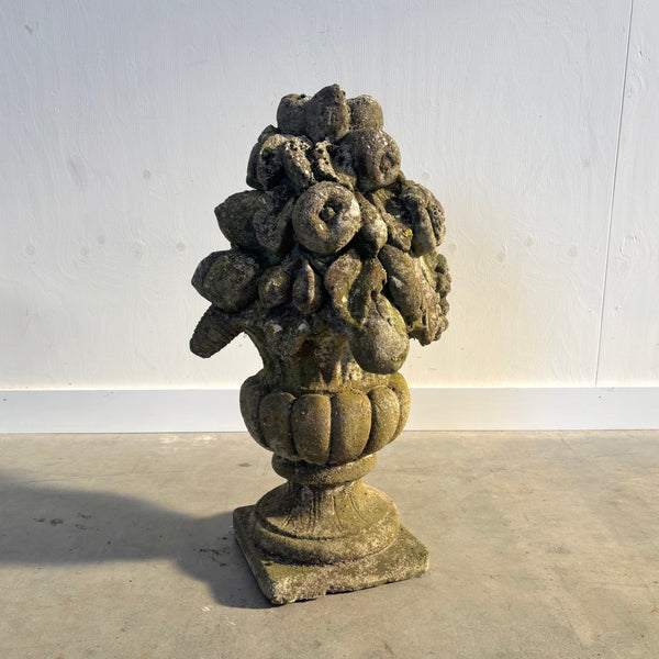 Ancient concrete potpourri of flowers and fruit