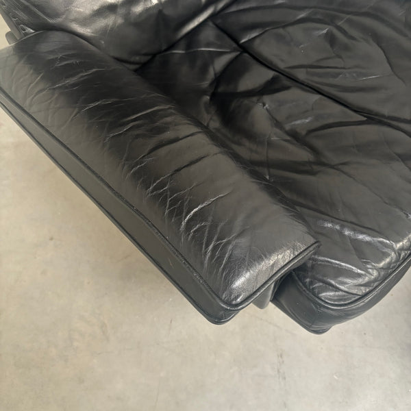 Black leather De Sede lounge hair with hocker, DS31