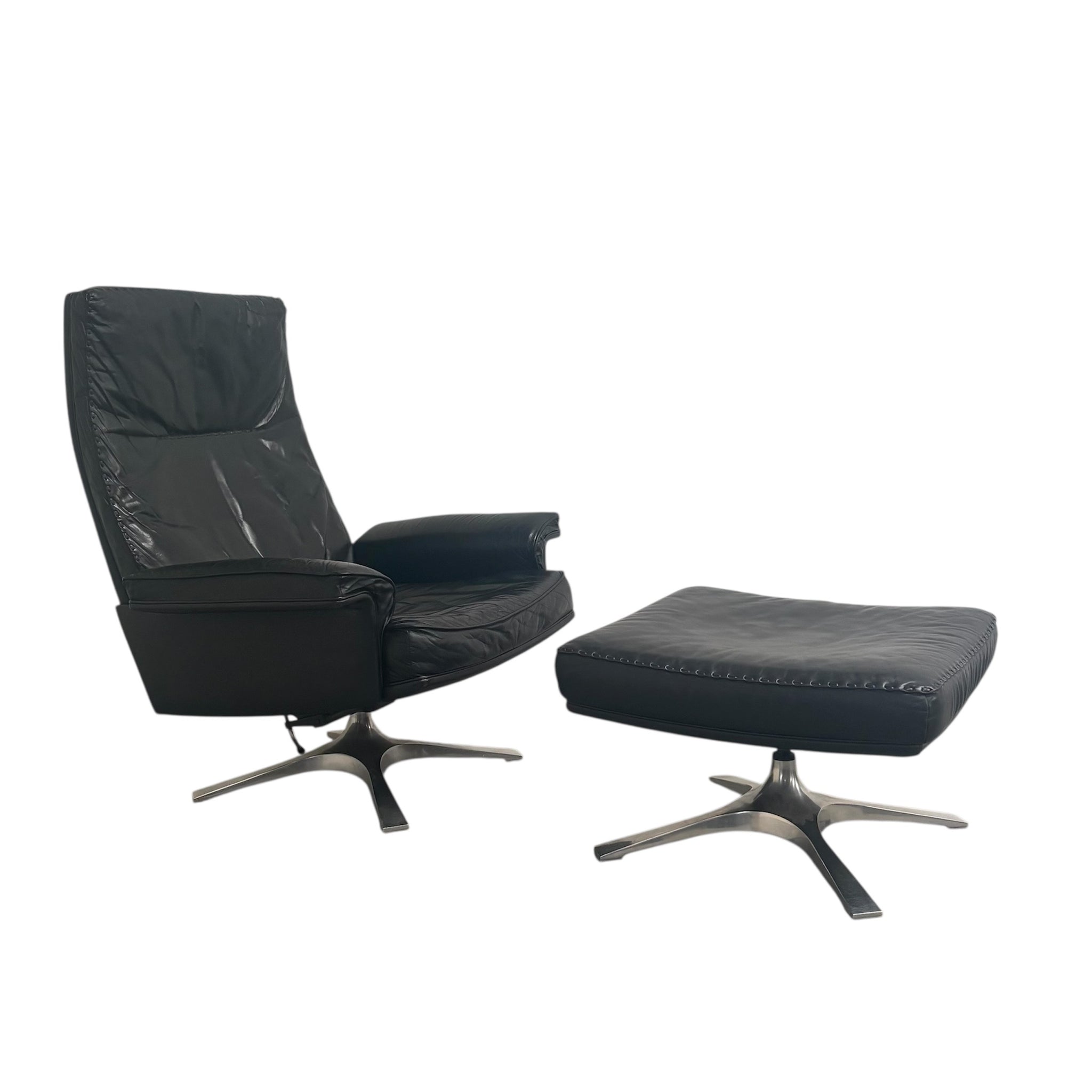 Black leather De Sede lounge hair with hocker, DS31