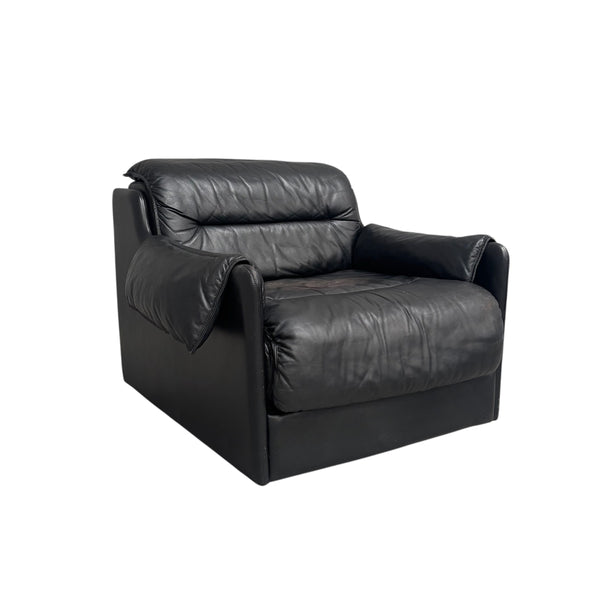 Black leather lounge chair by Dreipunkt, 1970s
